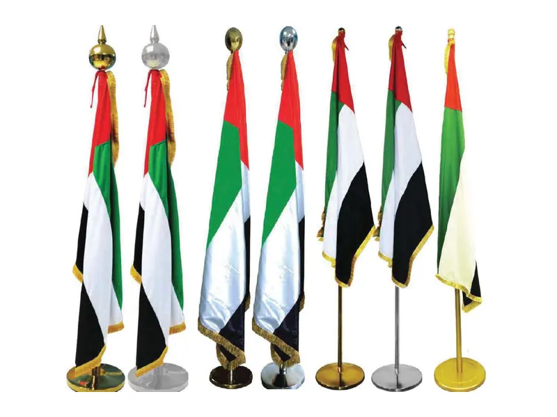 UAE office flags on gold and silver poles